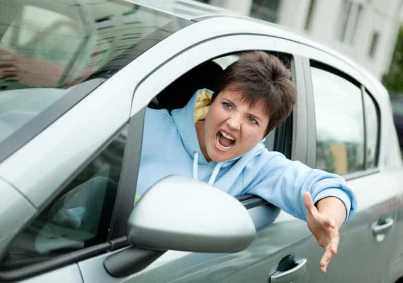 Angry Woman Driver Shouts and honks horn